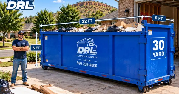 30 yard dumpster showing 22-foot length, 8-foot width, and 6-foot height with a worker for scale in Lawton, Oklahoma