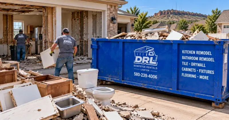Roll-off dumpster filled with kitchen and bathroom remodeling waste including cabinets, tile, drywall, flooring, and fixtures in Lawton, Oklahoma