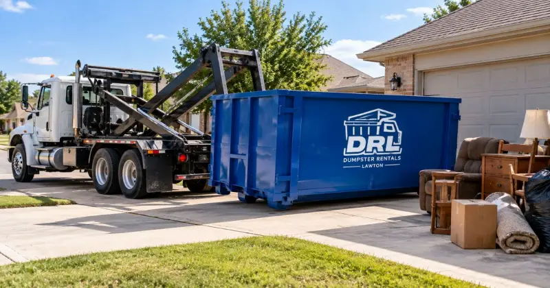 Dumpster rental delivery with a roll-off container being placed in a residential driveway for junk removal