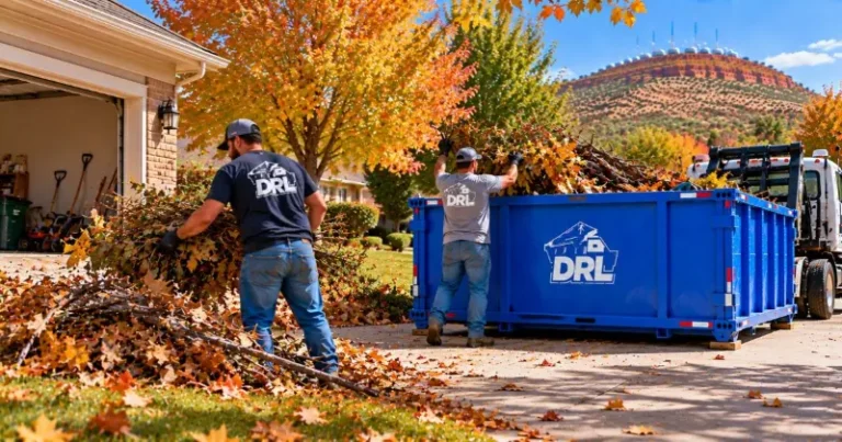 Fall cleanup with workers loading leaves, branches, and yard debris into a roll-off dumpster in Lawton, Oklahoma