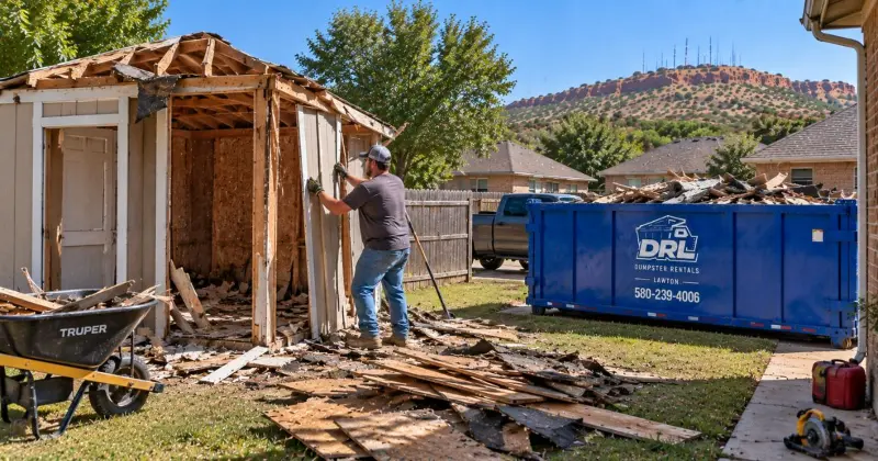 Homeowner dismantling a backyard shed with lumber and roofing debris ready for dumpster disposal in Lawton, Oklahoma