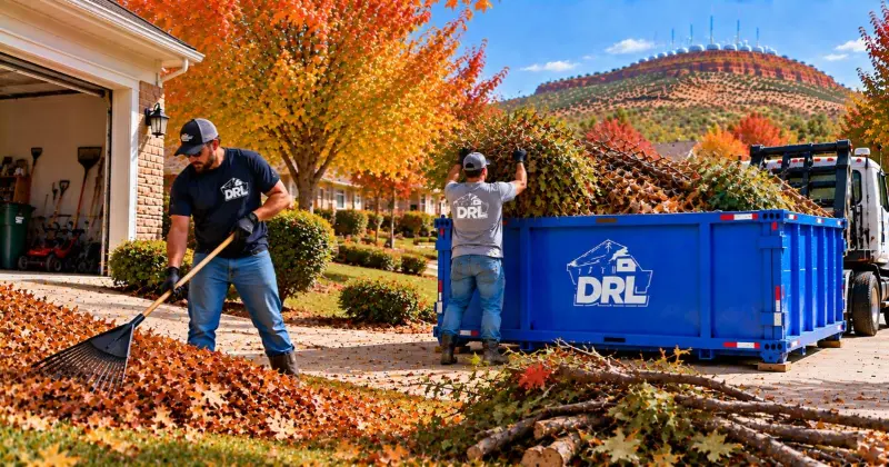 Fall yard debris disposal with leaves, branches, and seasonal yard waste being loaded into a roll-off dumpster in Lawton, Oklahoma